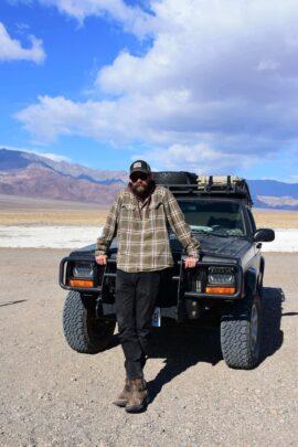 Jesse posing with his jeep
