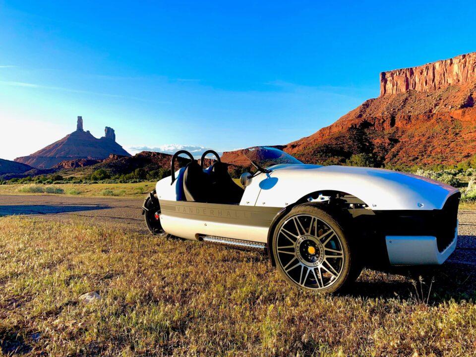 White Vanderhall at golden hour in below desert towers