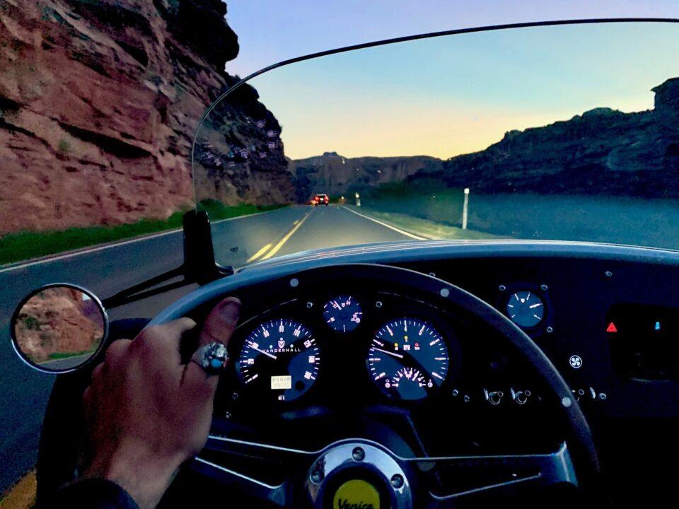 Vanderhall cockpit view and Potash road at nigh through the windshield