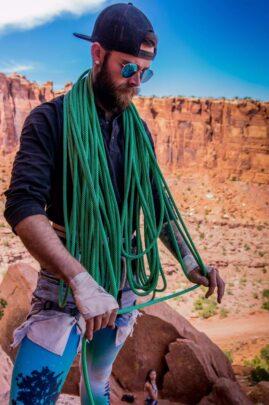Jesse coiling rope for a rock climb