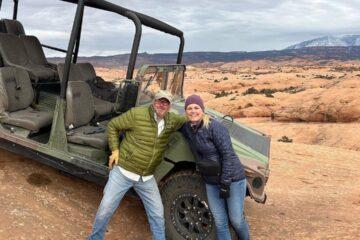 the couple posing with our military Hummer, Juan